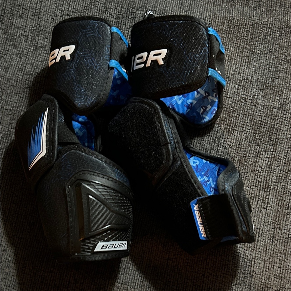 Bauer X large intermediate elbow ads barely worn because they are too big.